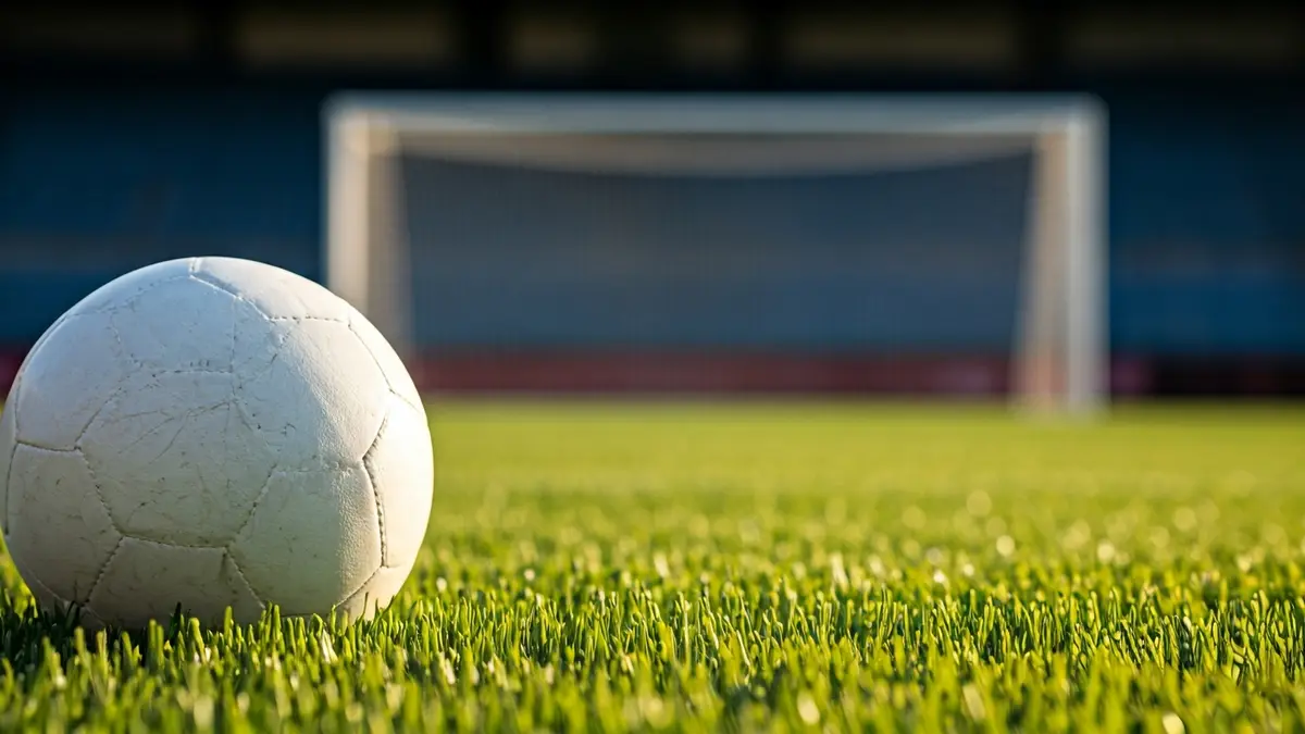 Generic image of a soccer ball on a stadium pitch.