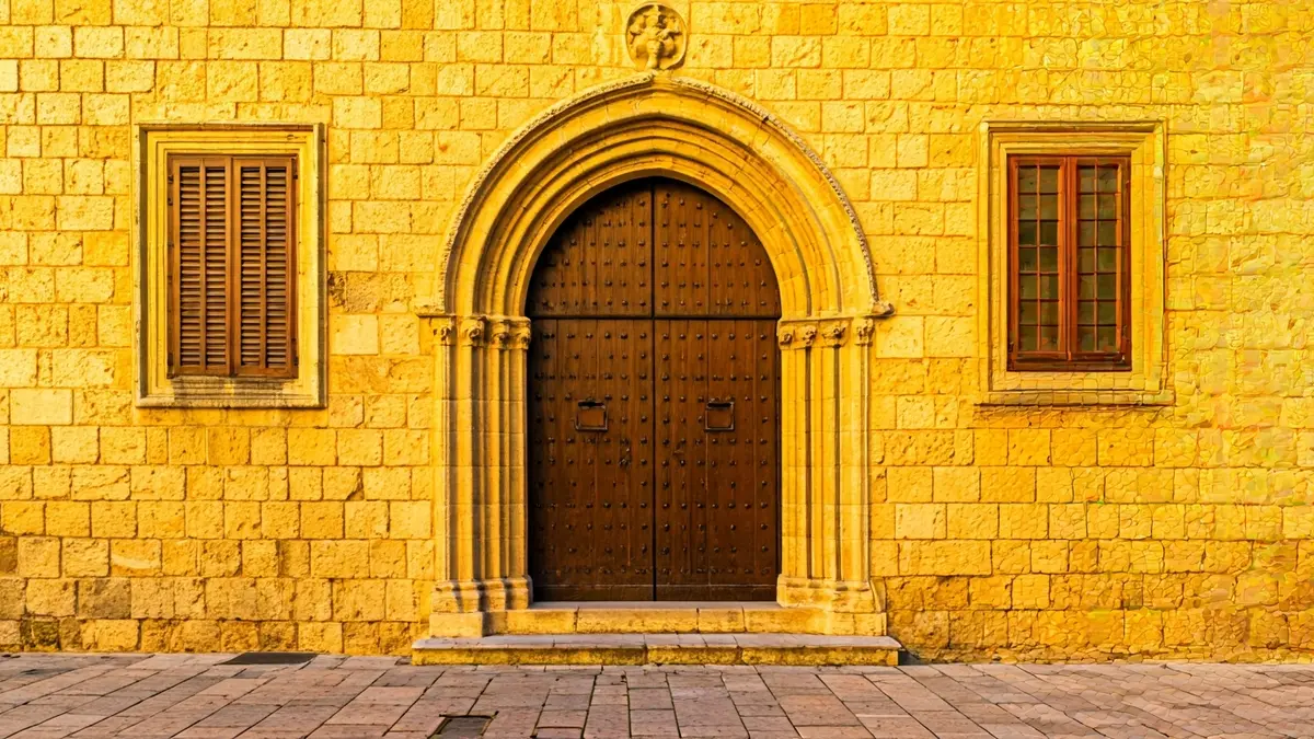 Restored facade of the Palau del Cardenal Ram in Morella, featuring Gothic and Renaissance elements.