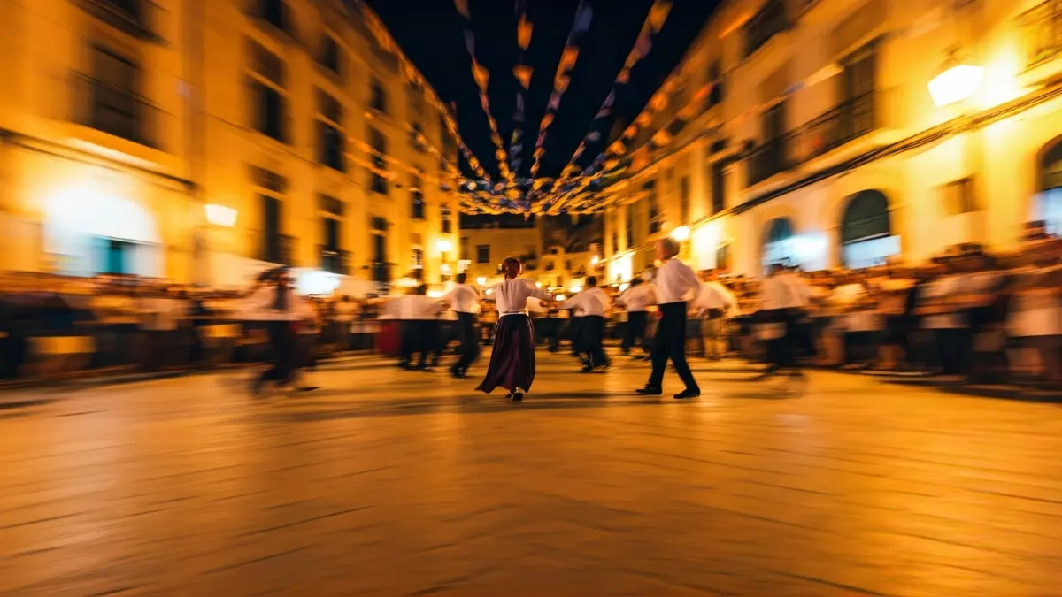 Imatge d'una celebració tradicional amb danses i música en un ambient festiu.