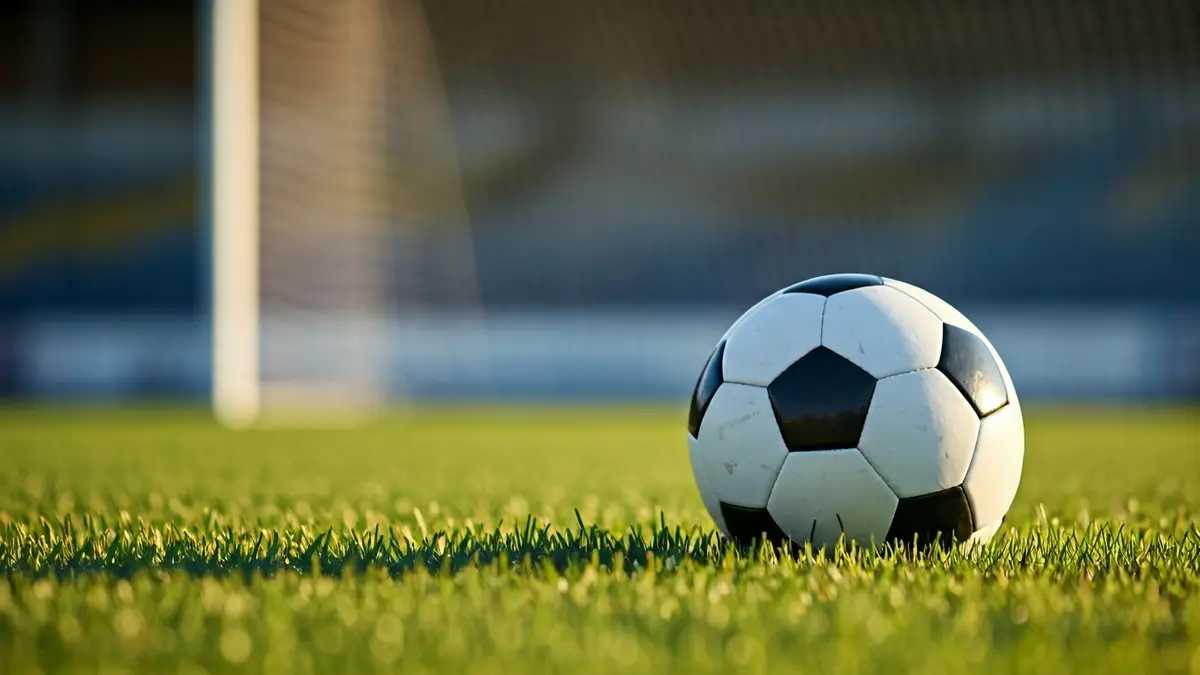 Generic image of a soccer ball on a grass field.