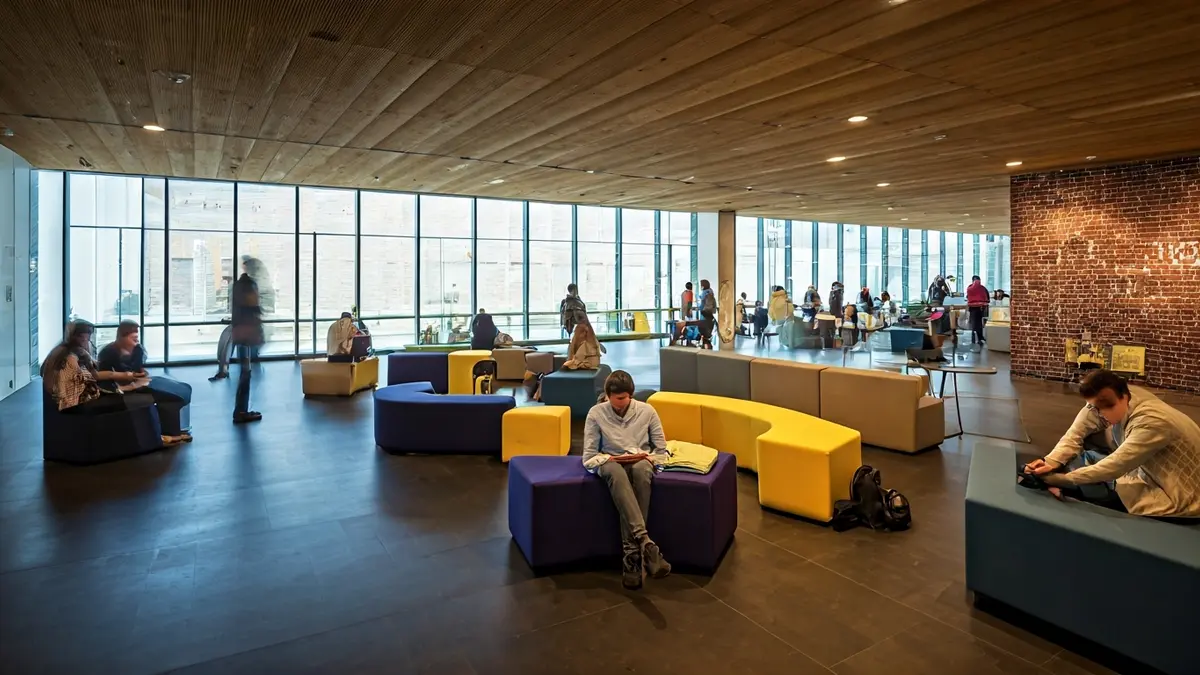 Generic image of a modern and welcoming youth space with young people interacting.