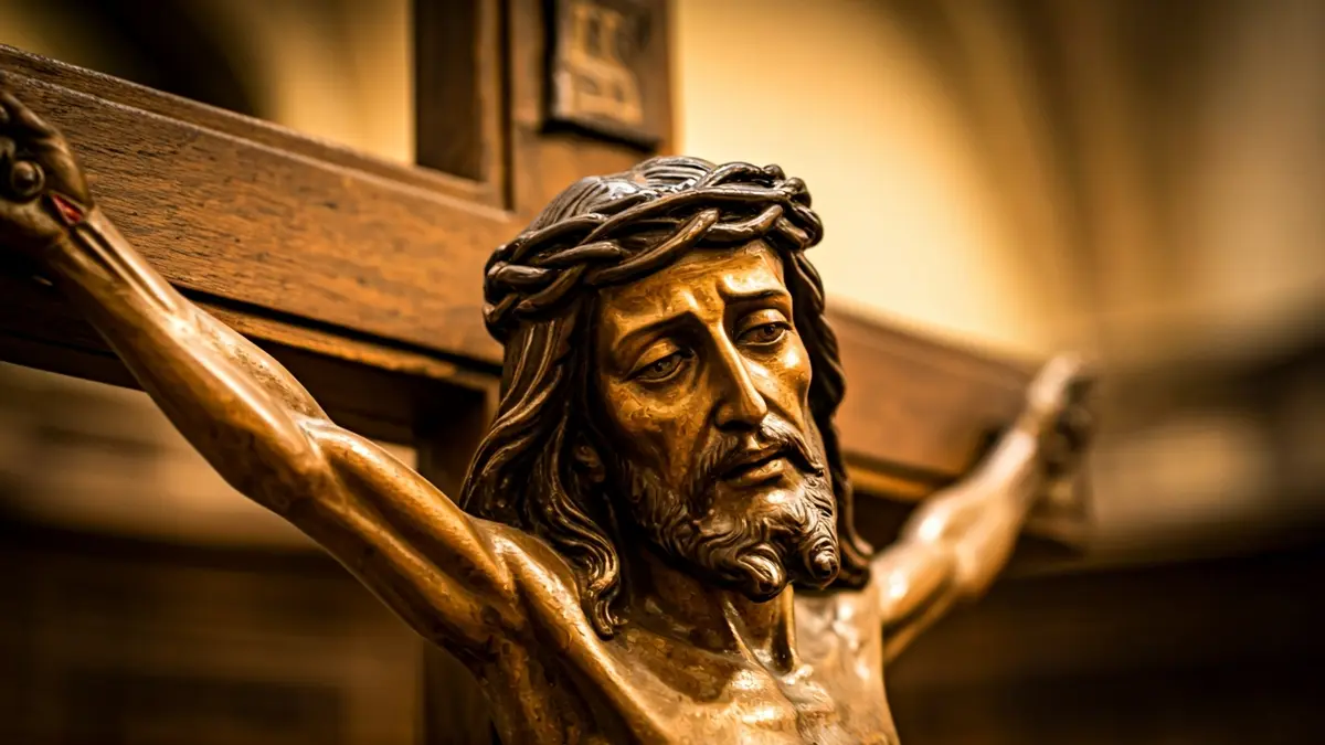 Image of an antique wooden crucifix with artistic details.