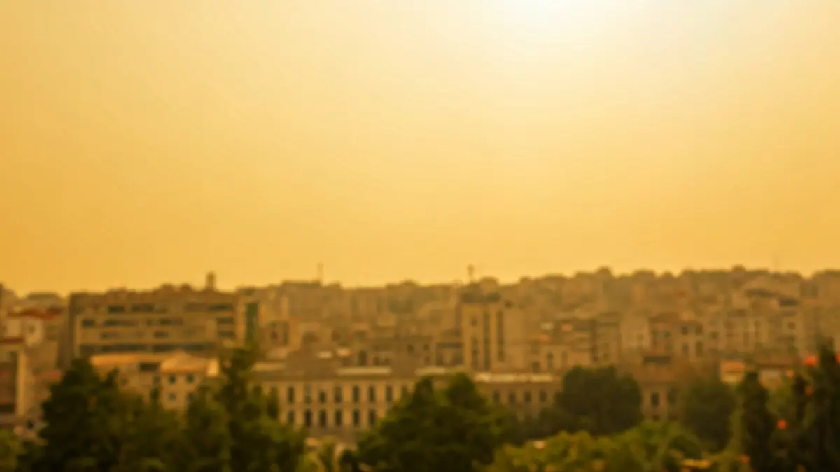 Generic image of an urban landscape with a hazy sky due to suspended dust.