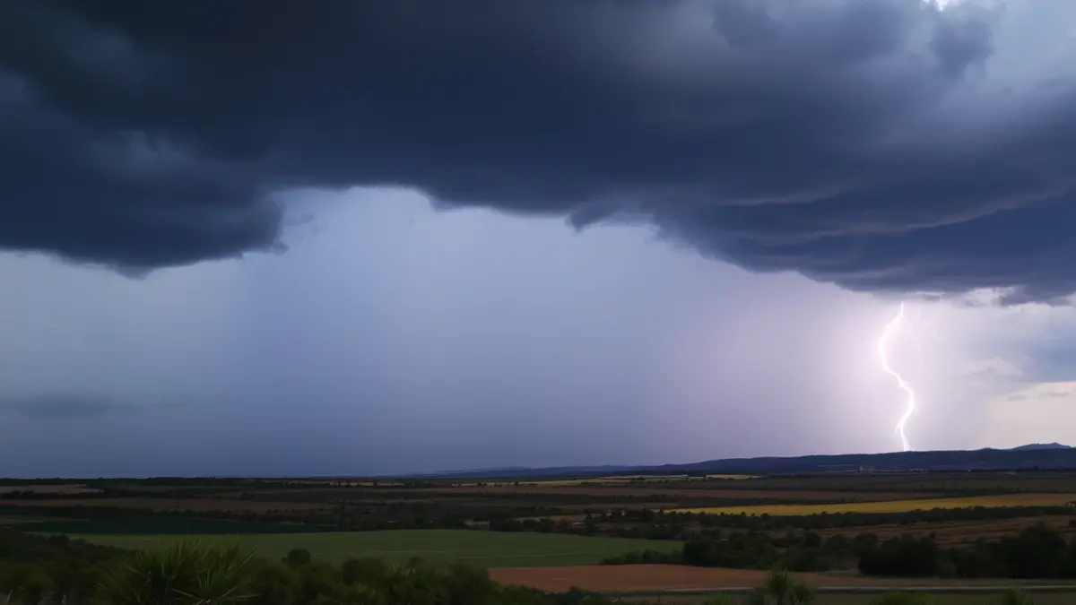 Generic image of a dark, stormy sky with heavy rain and lightning, indicating a rain and hail alert.