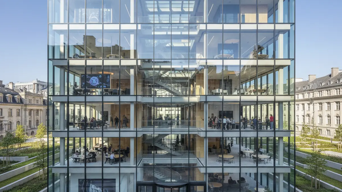 Imatge d'un edifici universitari modern amb grans façanes de vidre, que simbolitza la innovació i la transferència tecnològica.