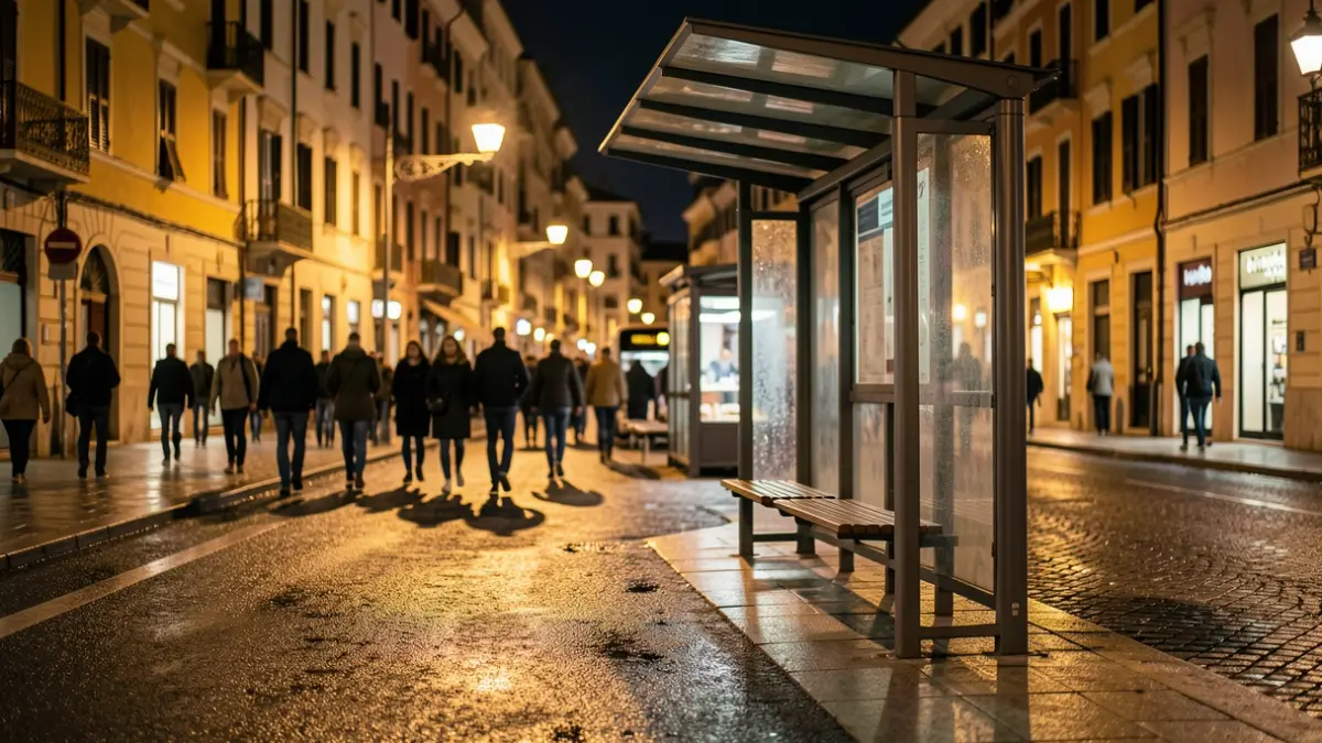 Generic image of a nighttime bus stop in a Mediterranean city.
