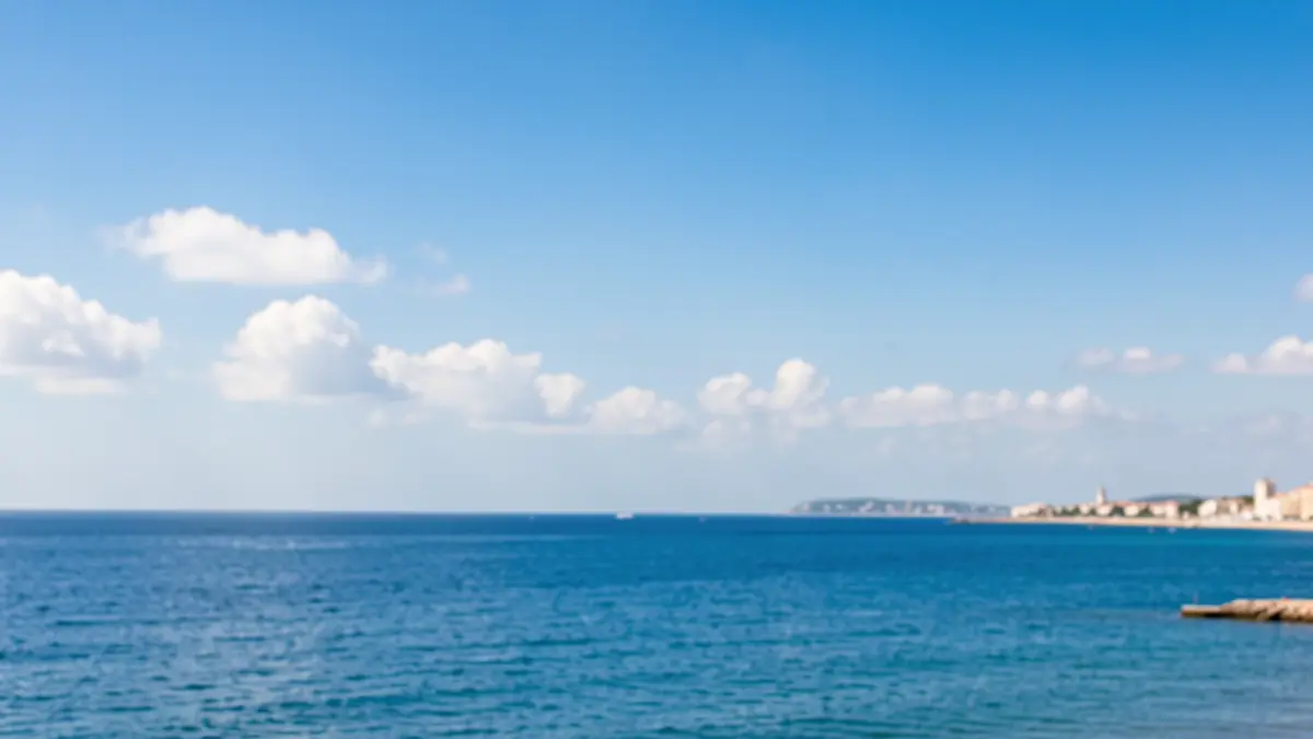 Generic image of the sky and coast of Gandia on a summer day.