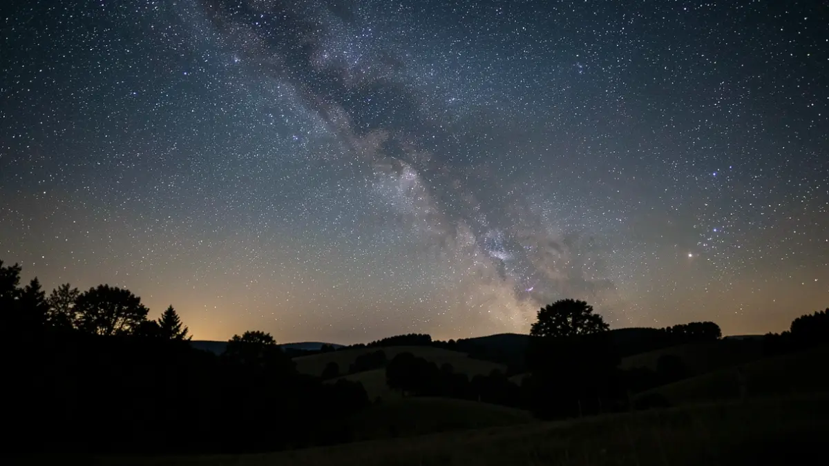 Generic image of a starry night sky over a natural landscape.